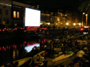 Dutch people watching movie on the canal