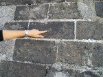 Arabic letters stamped into the bricks of the tower