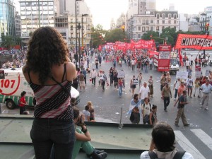 Shooting photos from the top of a newsstand.